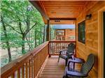 A couple of chairs on the front porch of the camping cabins at PIGEON RIVER CAMPGROUND - thumbnail