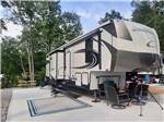 A fifth wheel trailer parked in a concrete site at LAUREL LAKE CAMPING RESORT - thumbnail