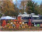 Carved pumpkins in front of a fifth wheel trailer at LAUREL LAKE CAMPING RESORT - thumbnail