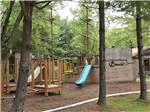 The wooden playground equipment at MAPLEWOOD ACRES RV PARK - thumbnail