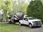 Truck towing fifth wheel onsite at MAPLEWOOD ACRES RV PARK - thumbnail
