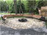 Benches placed in circle around fire pit at MAPLEWOOD ACRES RV PARK - thumbnail