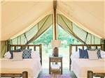 Two beds inside of the glamping tents at SUN OUTDOORS REHOBOTH BAY - thumbnail