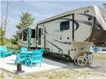A fifth wheel backed in at a RV site at SUN OUTDOORS REHOBOTH BAY - thumbnail