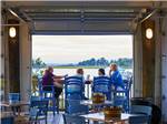 A family enjoying the lake view from a deck at SUN OUTDOORS REHOBOTH BAY - thumbnail