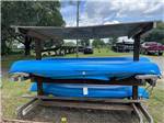 A rack of blue kayaks at SPORTSMAN'S COVE RESORT - thumbnail
