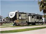 A fifth wheel parked in a RV site at STELLA MARE RV RESORT - thumbnail
