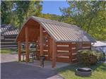 One of the rustic camping cabins at RIVEREDGE RV PARK & CABIN RENTALS - thumbnail