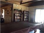 The pool table and lending library at CRAZY HORSE RV RESORT - thumbnail