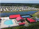 An aerial view of the office, swimming pool and tennis courts at KEYSTONE HEIGHTS RV RESORT - thumbnail