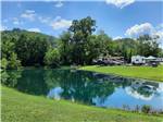 Grassy RV sites by the water at 4 GUYS RV PARK - thumbnail