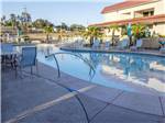 Swimming pool with outdoor seating at BERRY CREEK RANCHERIA RV PARK - thumbnail