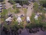 An aerial view of the RV sites by the water at CASTLE LAKE CAMPGROUND & COTTAGES - thumbnail