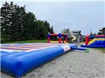 The jumping pad and bouncing houses at CASTLE LAKE CAMPGROUND & COTTAGES - thumbnail