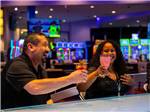 A couple having a couple of alcoholic drinks at 12 TRIBES OMAK CASINO HOTEL & RV PARK - thumbnail