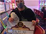 A Jackpot winner sitting at a video poker machine at 12 TRIBES OMAK CASINO HOTEL & RV PARK - thumbnail