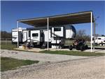 Fifth wheel in covered campsite at WEST GATE RV PARK - thumbnail