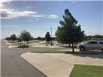 A row of paved sites at WANDERLUST CROSSINGS RV PARK - thumbnail