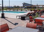 The pool area with seating at NORTHERN QUEST RV RESORT - thumbnail