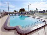 The outdoor pool next to the shuffleboard courts at WINTER PARADISE RV RESORT - thumbnail