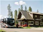A class A motorhome checking in at the front office at WEST GLACIER RV PARK & CABINS - thumbnail
