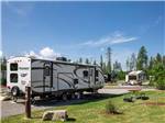 A travel trailer in a RV site at WEST GLACIER RV PARK & CABINS - thumbnail