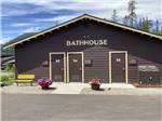 The brown bathhouse building at WEST GLACIER RV PARK & CABINS - thumbnail