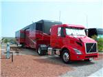 A big rig pulling a 5th wheel trailer at RAIN SPIRIT RV RESORT - thumbnail