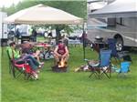 Family camping in RV at RIVERSIDE CAMPING & RV RESORT - thumbnail
