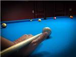Pool table in game room at BREEZY OAKS RV PARK - thumbnail