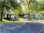 Grassy RV sites under trees at GENTILE'S CAMPGROUND - thumbnail