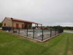 The fenced in swimming pool at EAST FORK RV RESORT - thumbnail