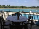 A table and chairs next to the swimming pool at EAST FORK RV RESORT - thumbnail