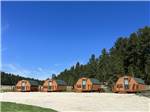 A row of the rental cabins at CUSTER CROSSING FAMILY CAMPGROUND - thumbnail