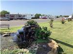 A water fountain with RV sites in the back at DO DROP INN RV RESORT & CABINS - thumbnail