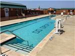 The swimming pool with park name on the bottom of it at DO DROP INN RV RESORT & CABINS - thumbnail