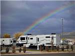 A rainbow over the paved RV sites at ASPEN GROVE RV PARK - thumbnail
