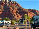 RVs parked in backed in sites at GRAND PLATEAU RV RESORT AT KANAB - thumbnail