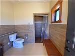 Very clean restroom with a shower at GRAND PLATEAU RV RESORT AT KANAB - thumbnail