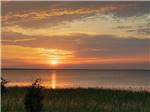 A view of the ocean at sunset at OUTER BANKS WEST/CURRITUCK SOUND KOA HOLIDAY - thumbnail