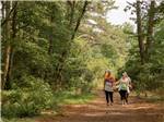 A family enjoying a hike on a trail at OUTER BANKS WEST/CURRITUCK SOUND KOA HOLIDAY - thumbnail