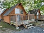 Cabins with front porches at GATEWAY TO THE SMOKIES RV PARK & CAMPGROUND - thumbnail