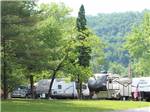 A grassy area in front of some RV sites at GATEWAY TO THE SMOKIES RV PARK & CAMPGROUND - thumbnail