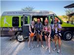 Four girls standing in front of a van at BIGFOOT ADVENTURE RV PARK & CAMPGROUND - thumbnail