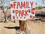 A family park sign on a stump at ST JOHNS RV RESORT - thumbnail