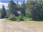 Basketball hoop and dirt court at RED EAGLE CAMPGROUND - thumbnail