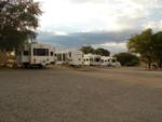 Gravel road with 5th wheels parked on gravel sites at Ridge Park RV & Campground - thumbnail