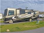 A motorhome parked in a paved site at COPPER COURT RV PARK - thumbnail