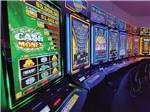 Gambling machines shining in a row at BIG ARM RESORT & CASINO - thumbnail
