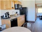 Kitchen with wooden cabinets at BIG ARM RESORT & CASINO - thumbnail
